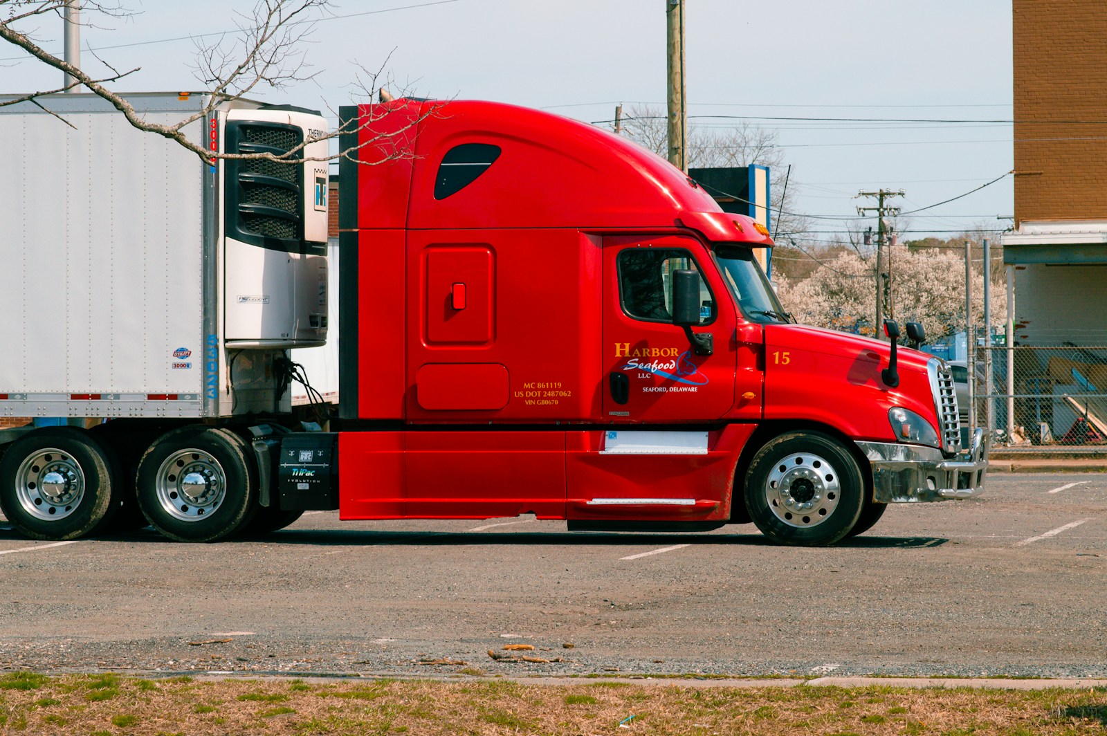 red and white truck on road during daytime, commercial auto